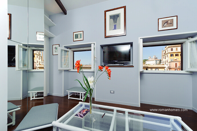 View of the second sitting room while seated in the sofa: notice the panoramic window views