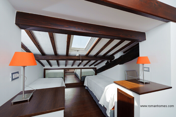 The twin beds area with sky window